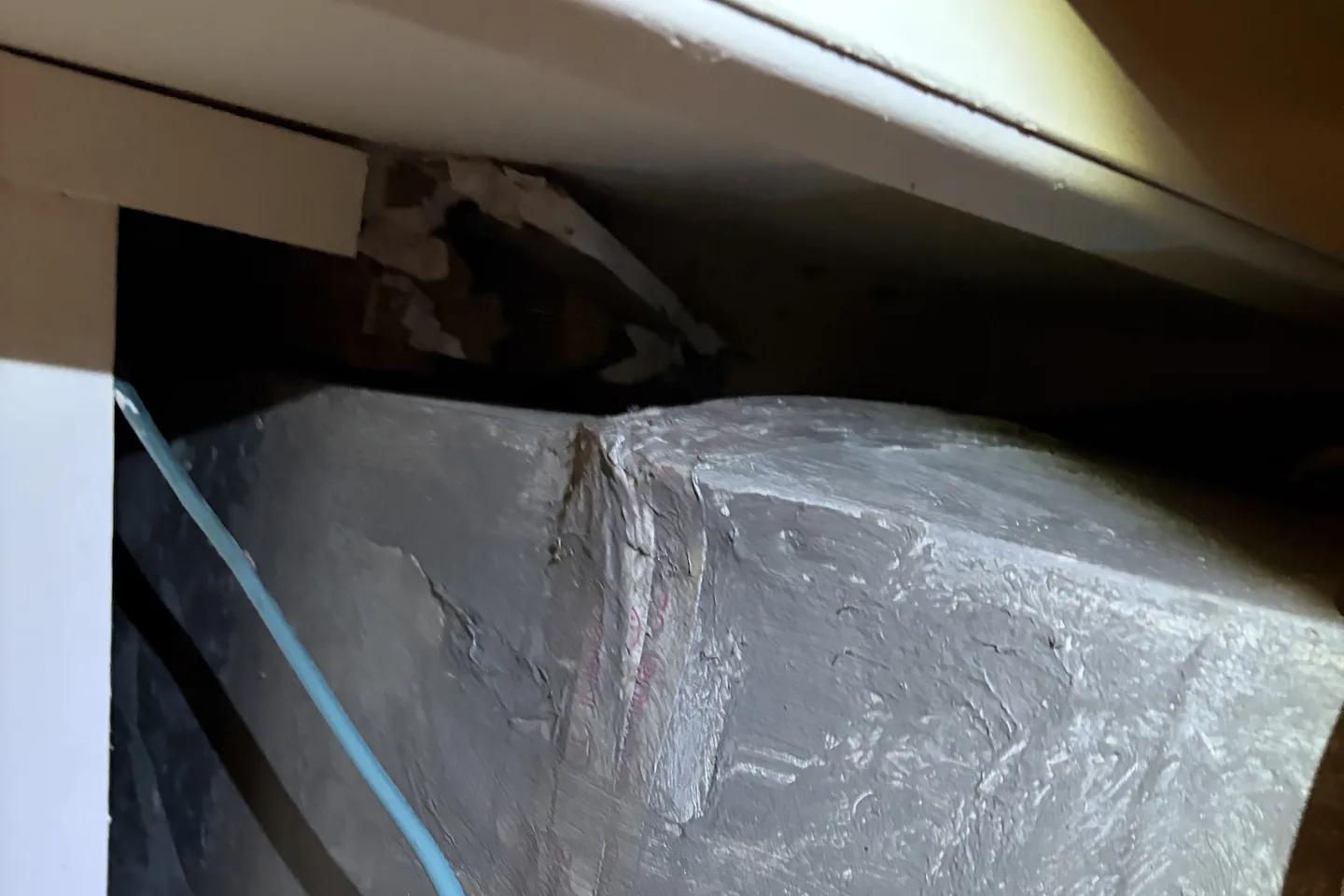 Large unsealed gap around HVAC ductwork allowing attic air into a bedroom closet