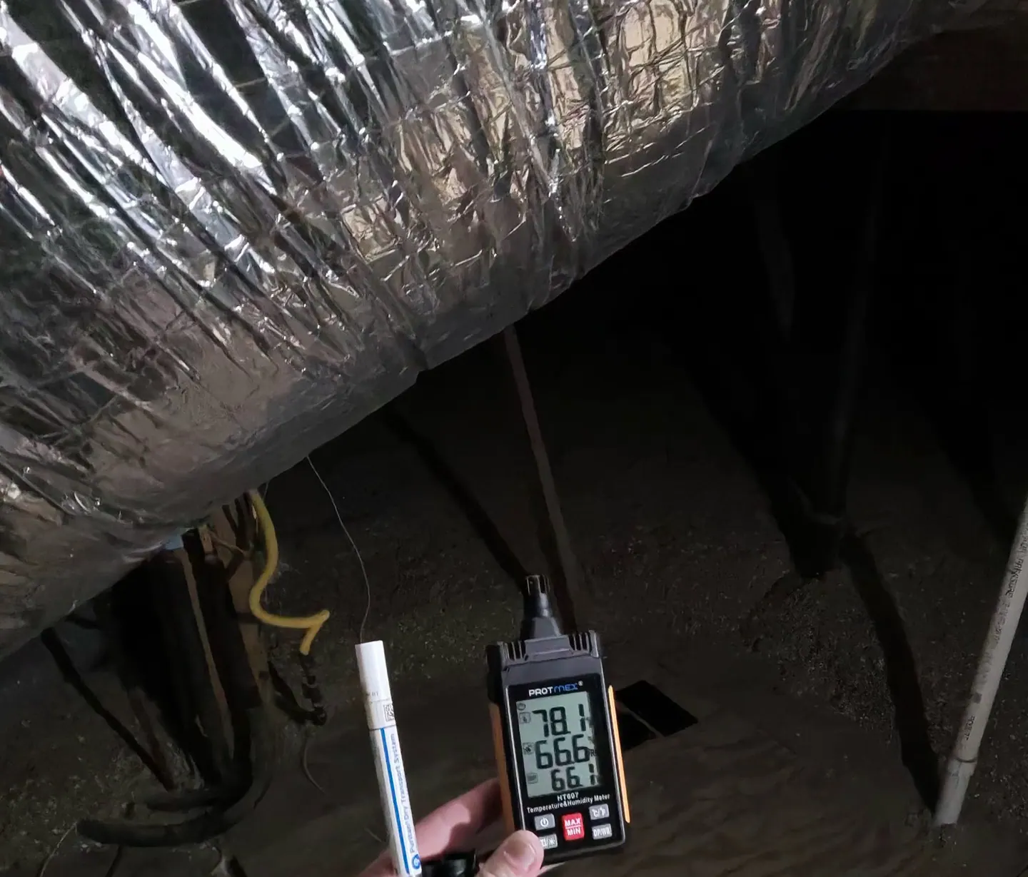 Instrument displaying attic air temperature, relative humidity and dew point near the HVAC air handler