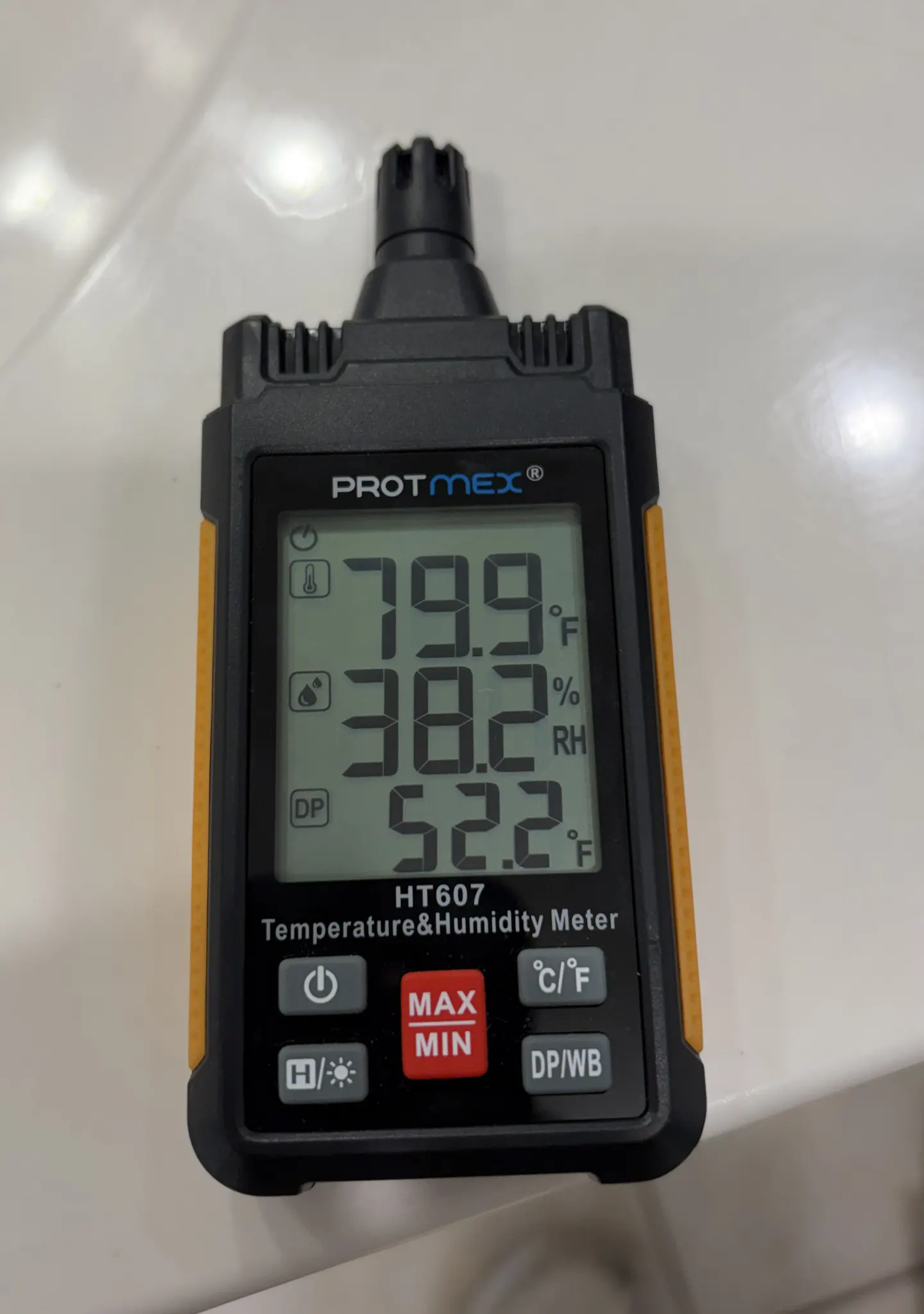 Indoor instrument displaying 79.9 degrees Fahrenheit and 38.2 percent relative humidity