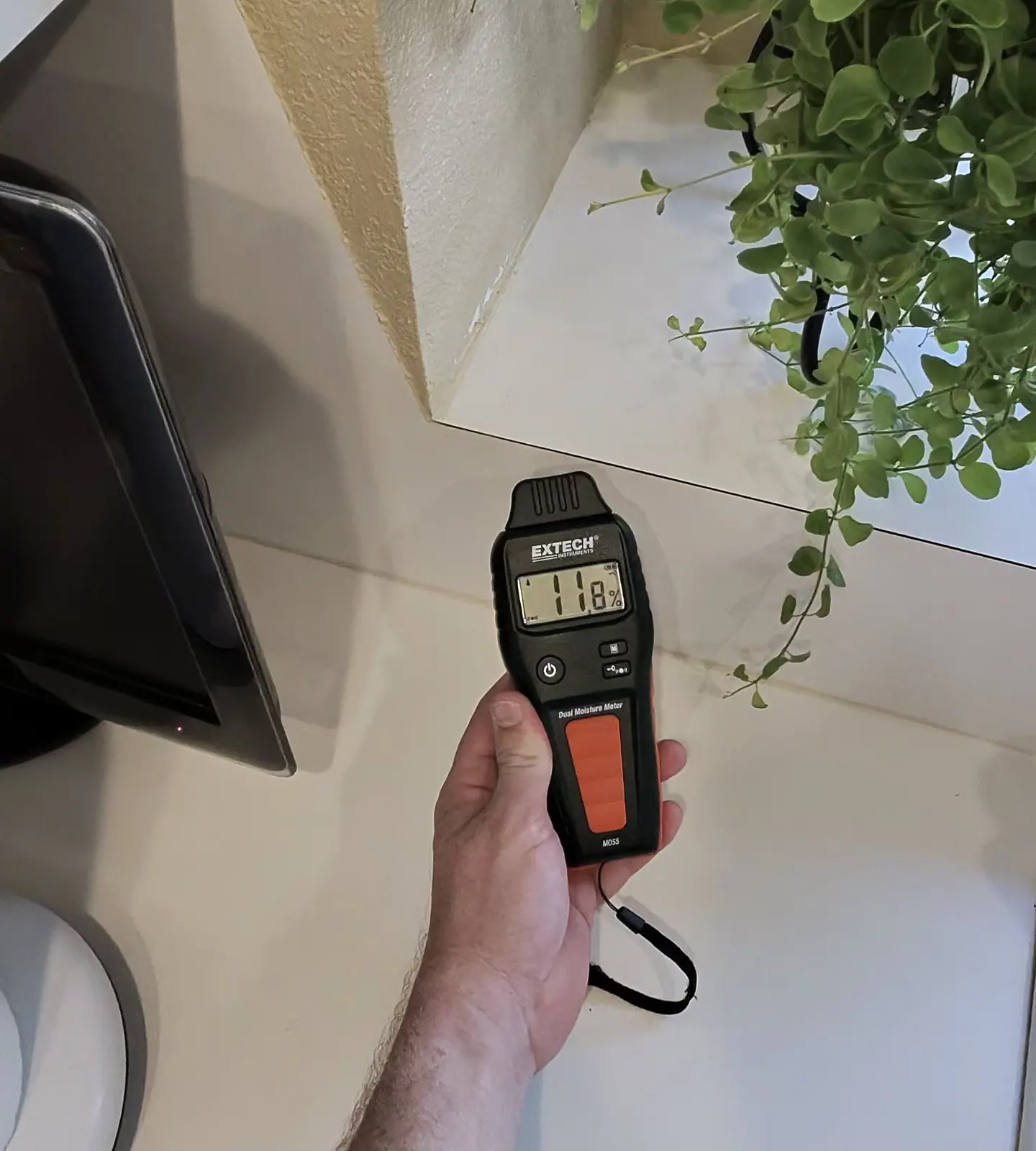 Instrument showing an 11.8 comparative moisture response at the opposite side of the same sill