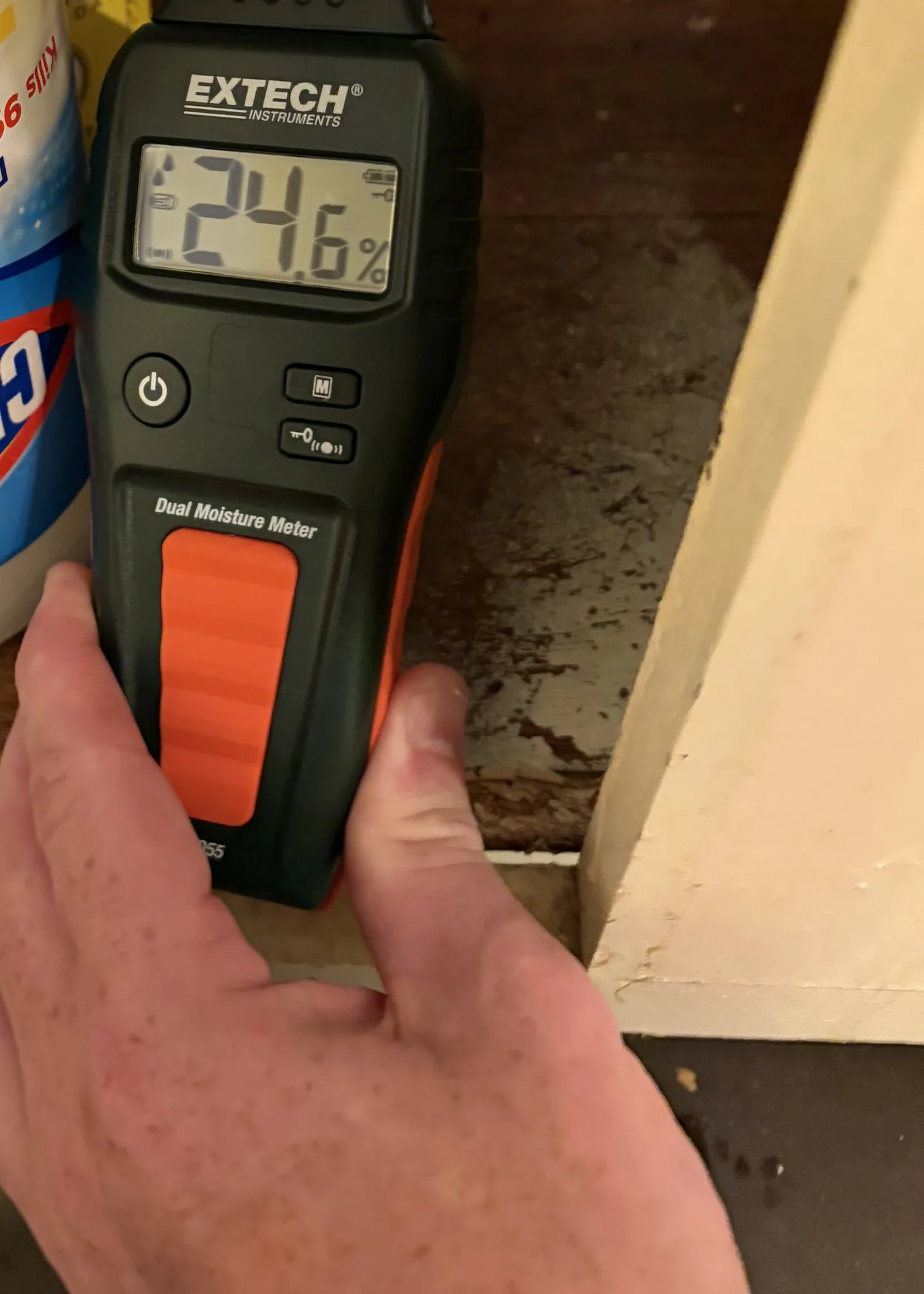 Comparative moisture reading inside kitchen sink base cabinet