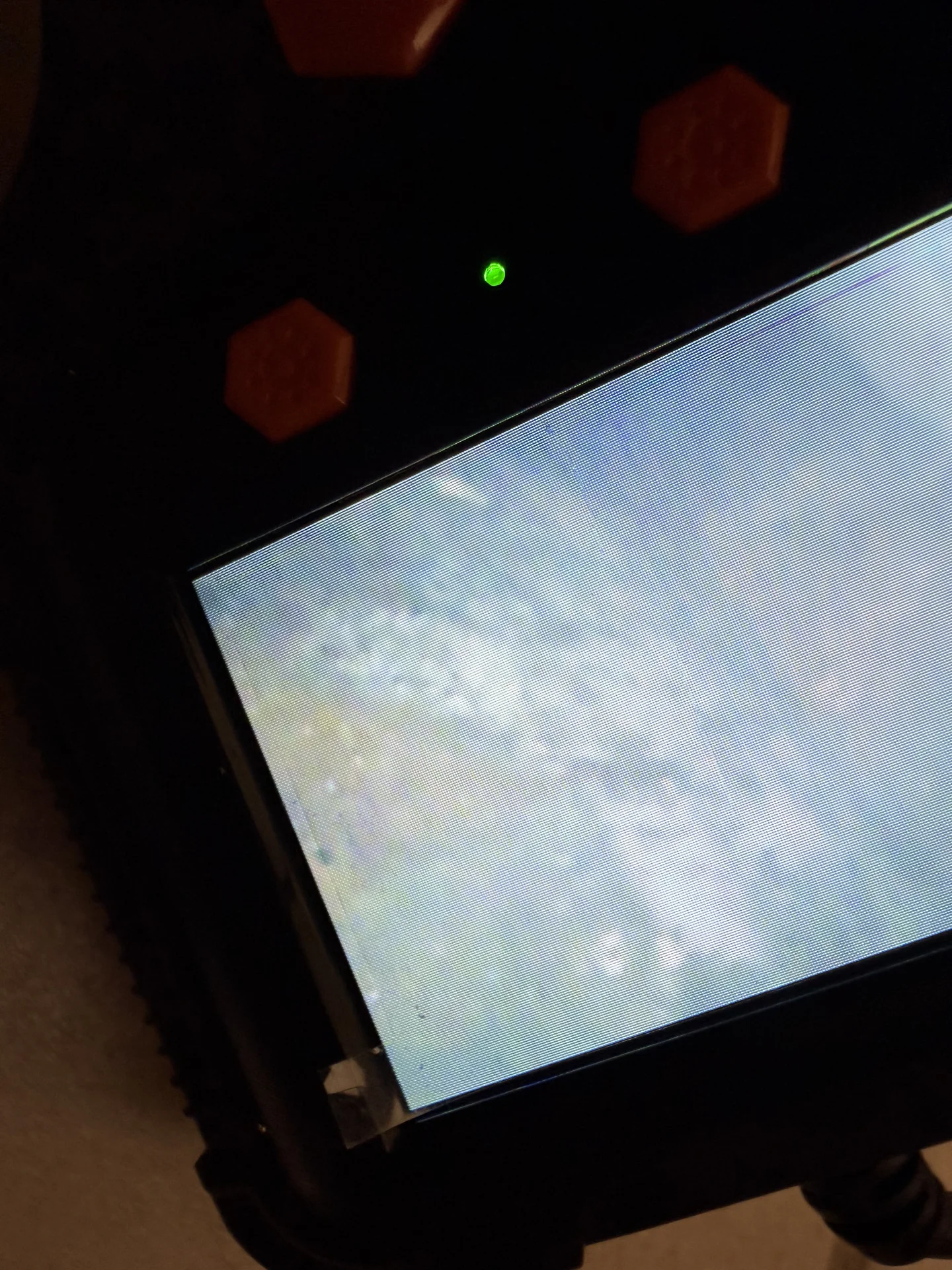 Borescope display showing the limited view of suspected mold beneath bathroom sink cabinet floor
