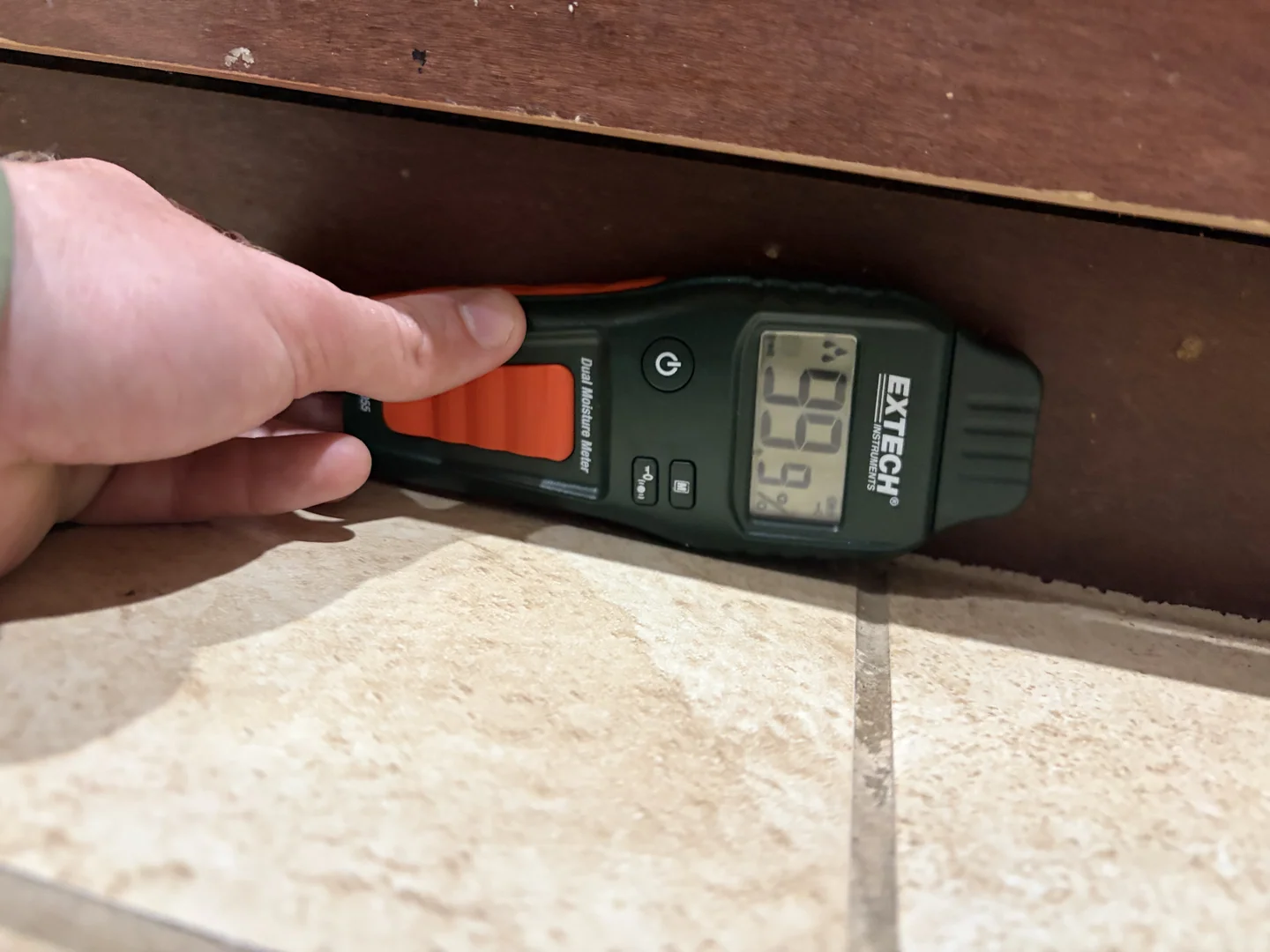 Maximum comparative moisture reading at kitchen cabinet base