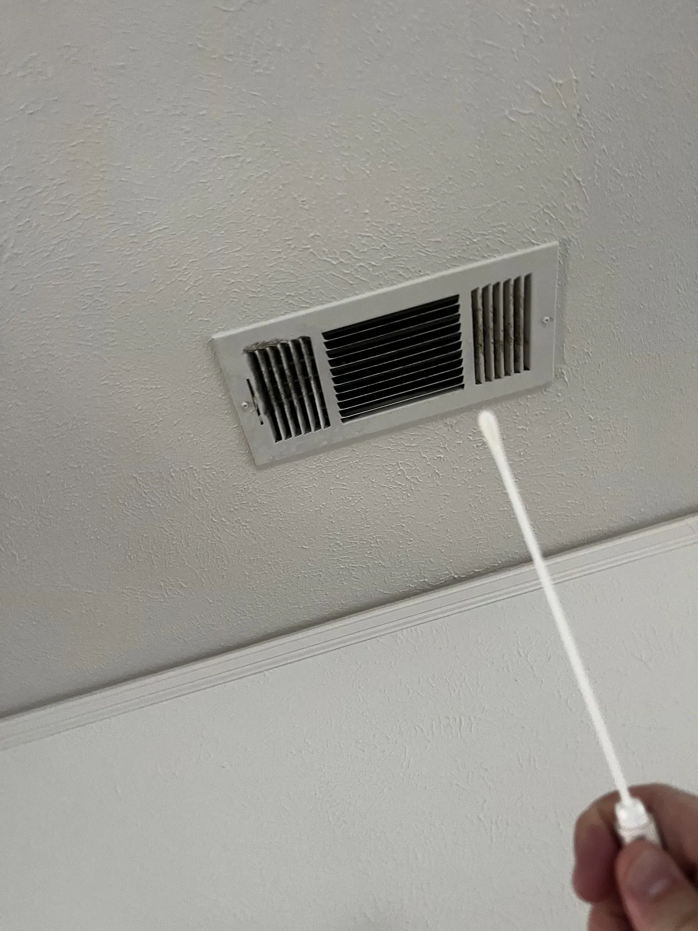Surface swab collection at the left playroom HVAC supply grill