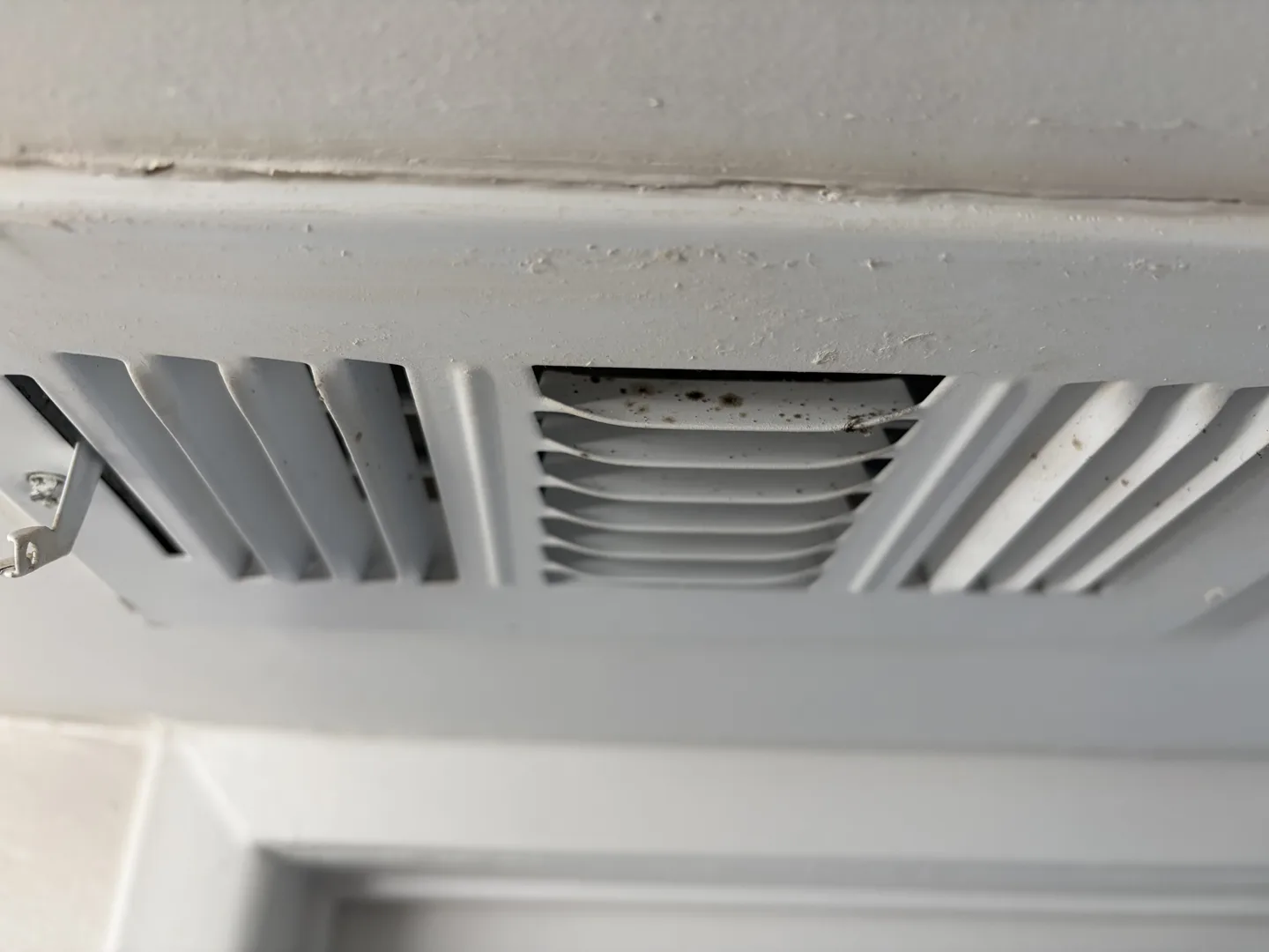 Dark spotting and discoloration on the second-floor bathroom HVAC supply register